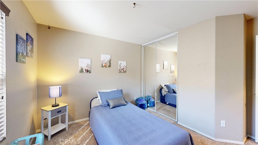 10375 Church Street, Unit 100 Rancho Cucamonga, CA 91730 - Photo 23 of 29 a bedroom with furniture and wooden floor