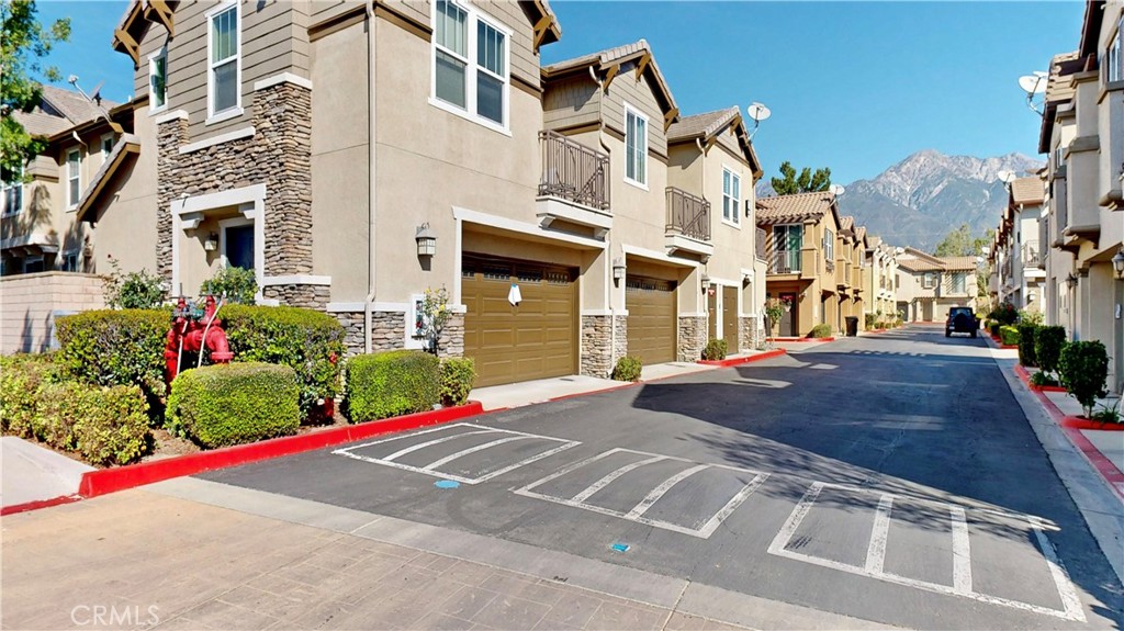 10375 Church Street, Unit 100 Rancho Cucamonga, CA 91730 - Photo 26 of 29 a view of a white apartments with large windows
