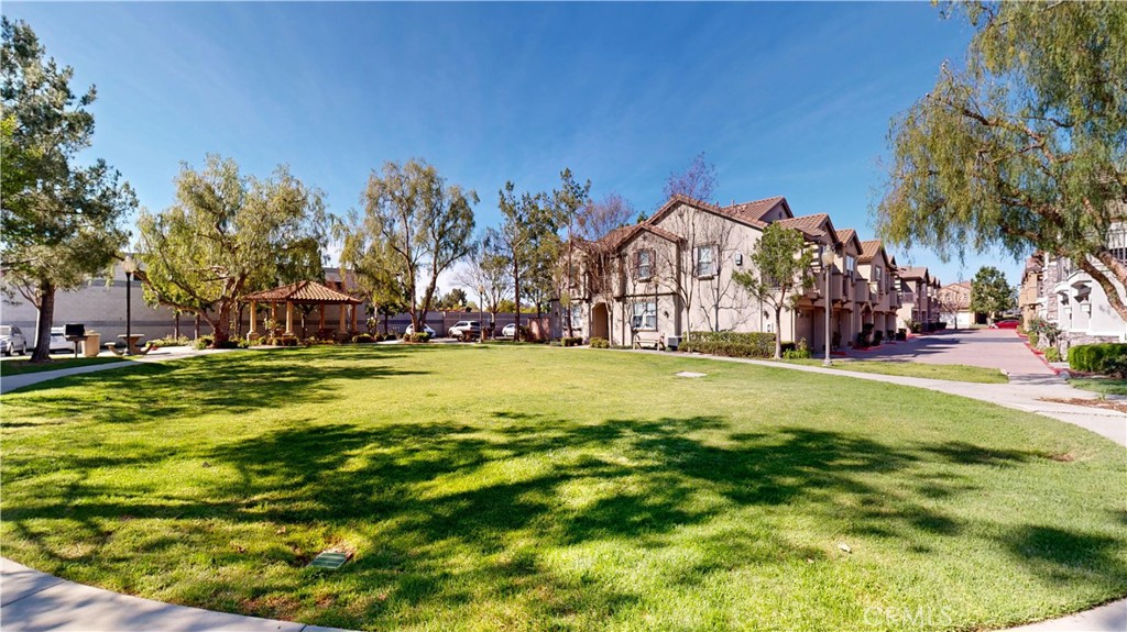 10375 Church Street, Unit 100 Rancho Cucamonga, CA 91730 - Photo 27 of 29 a view of a swimming pool with an outdoor space and seating area