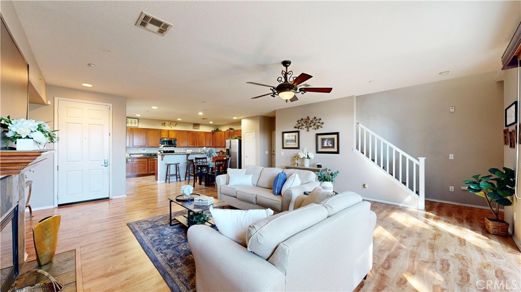 10375 Church Street, Unit 100 Rancho Cucamonga, CA 91730 - Photo 5 of 29 a living room with furniture and kitchen view