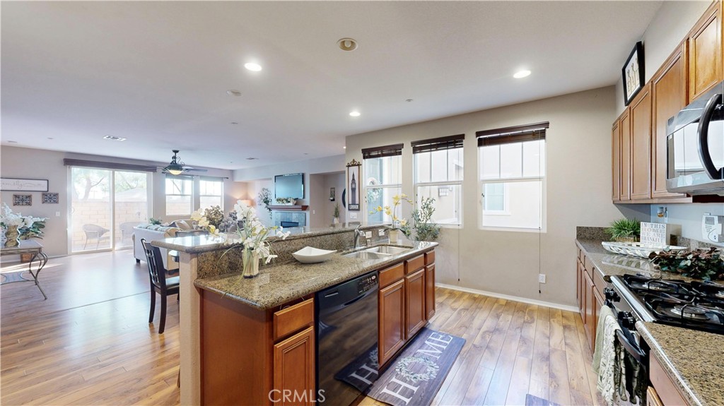 10375 Church Street, Unit 100 Rancho Cucamonga, CA 91730 - Photo 10 of 29 a kitchen that has a table and chairs in it