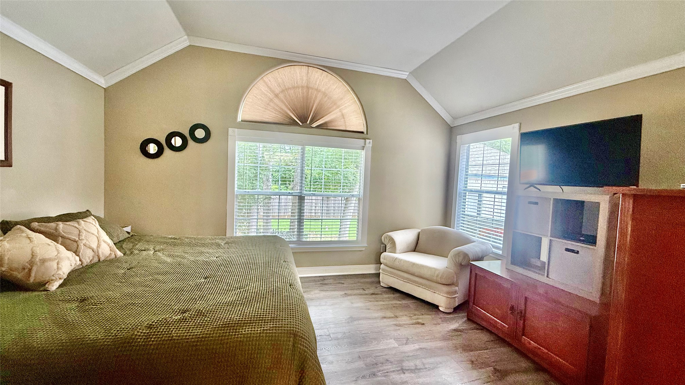 1127 Robin Road Elgin, TX 78621 - Photo 8 of 19 Bedroom with vaulted ceiling, ornamental molding, and wood finished floors