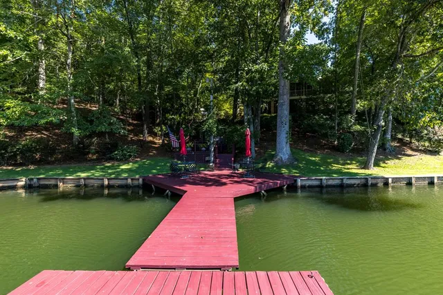 a view of swimming pool with a table and chairs