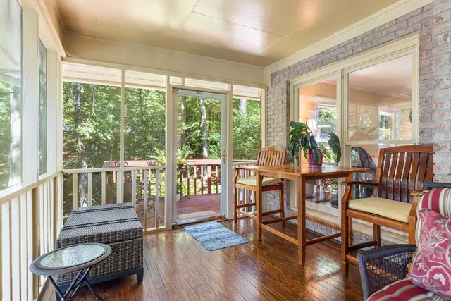 a view of a chair and table in the balcony