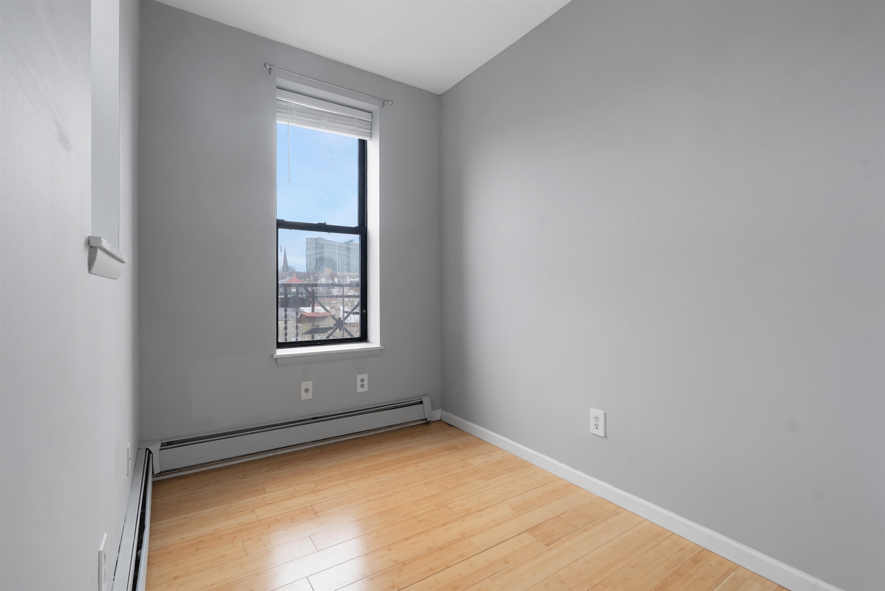809 Park Avenue, Unit 9 Hoboken, NJ 07030 - Photo 23 of 30 an empty room with a window