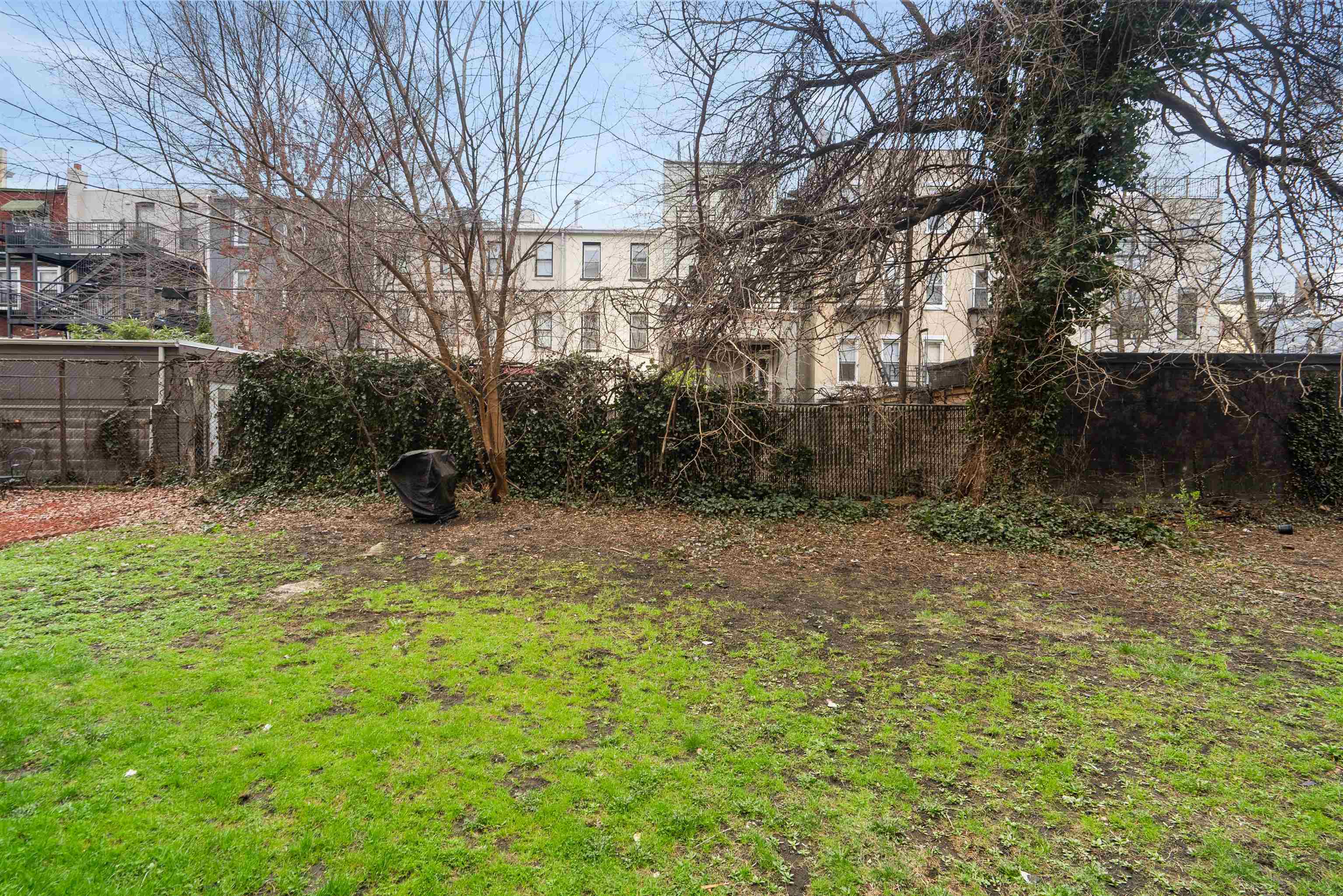 809 Park Avenue, Unit 9 Hoboken, NJ 07030 - Photo 26 of 30 a backyard of a house with lots of green space