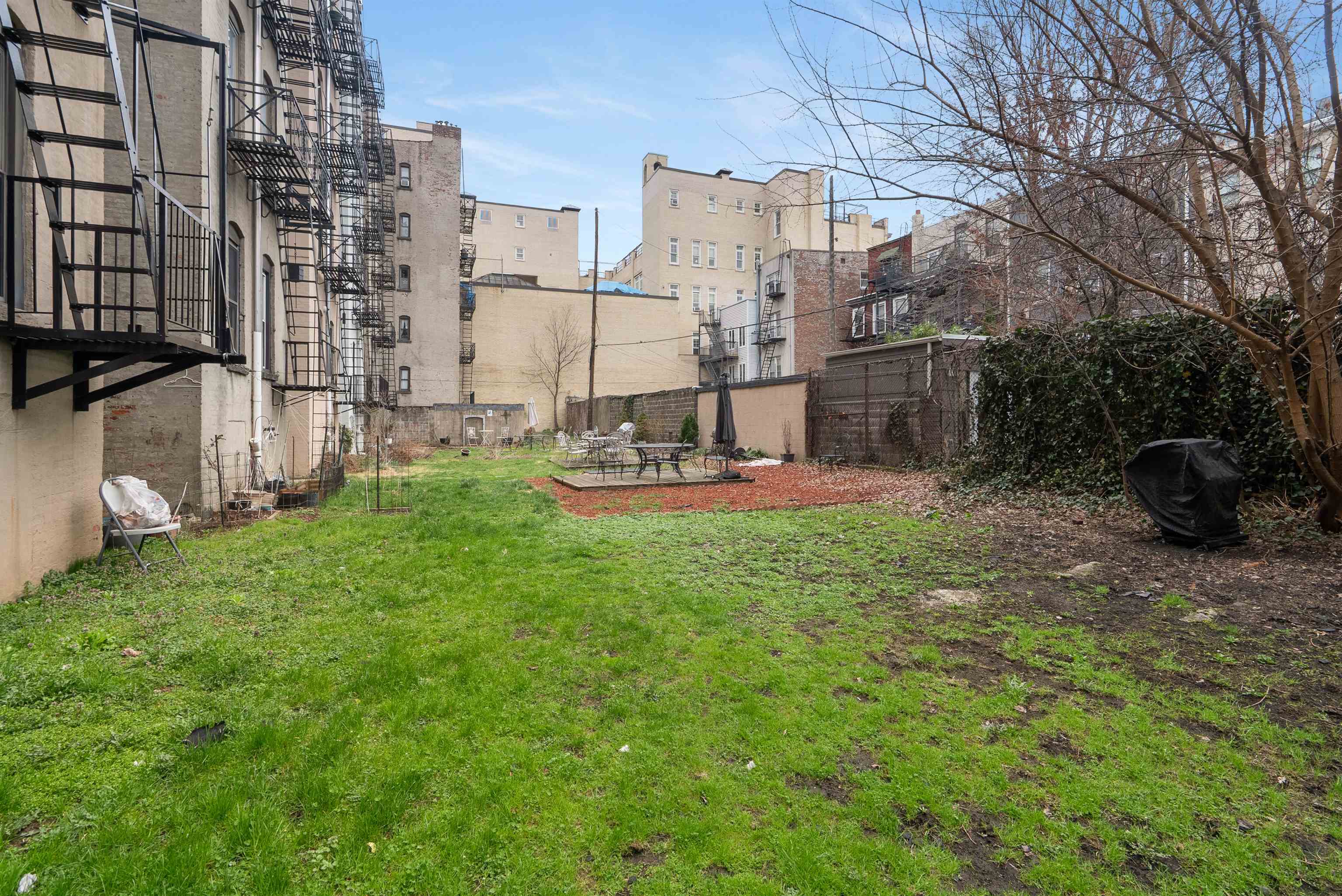 809 Park Avenue, Unit 9 Hoboken, NJ 07030 - Photo 27 of 30 a view of a chair and table in the garden