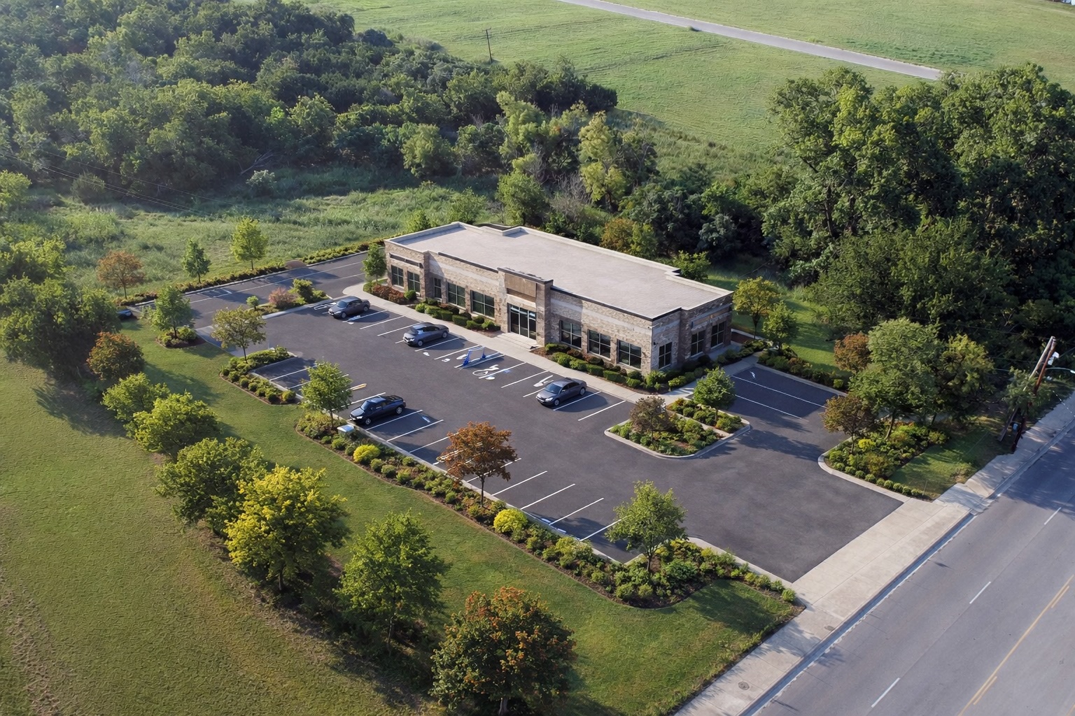 an aerial view of a house with a garden