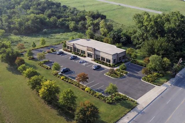 an aerial view of a house with a garden