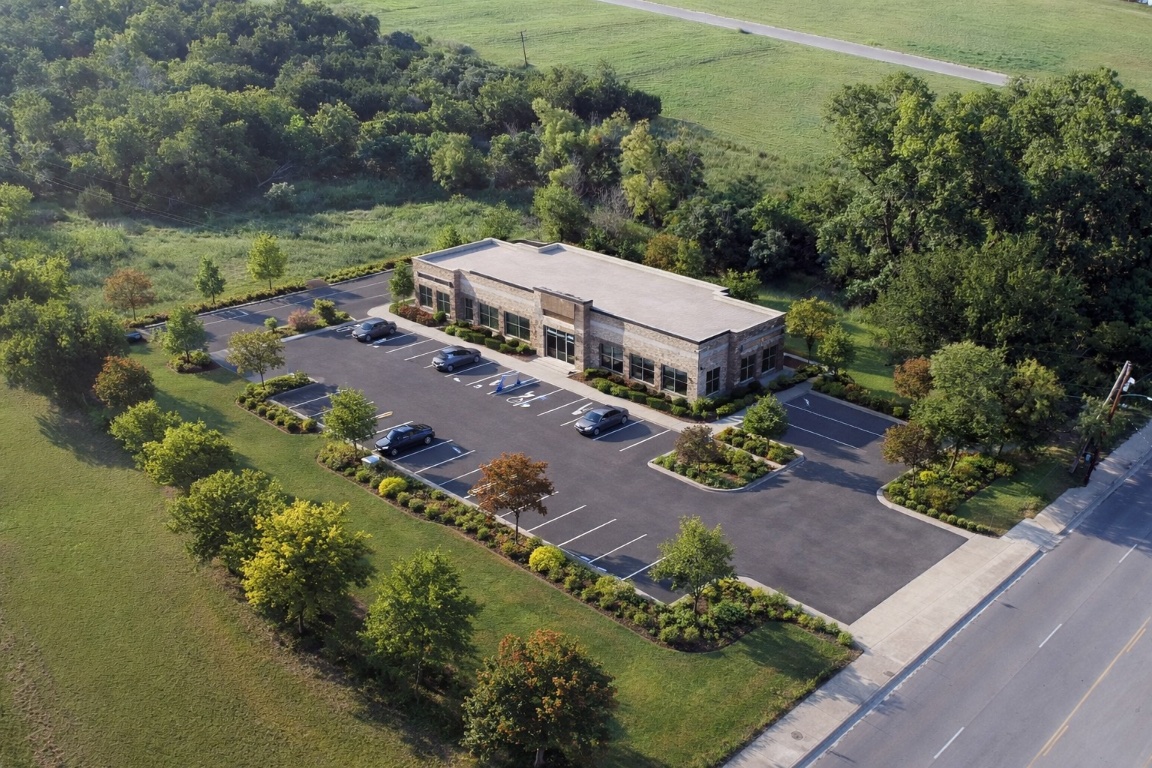 an aerial view of a house with a garden