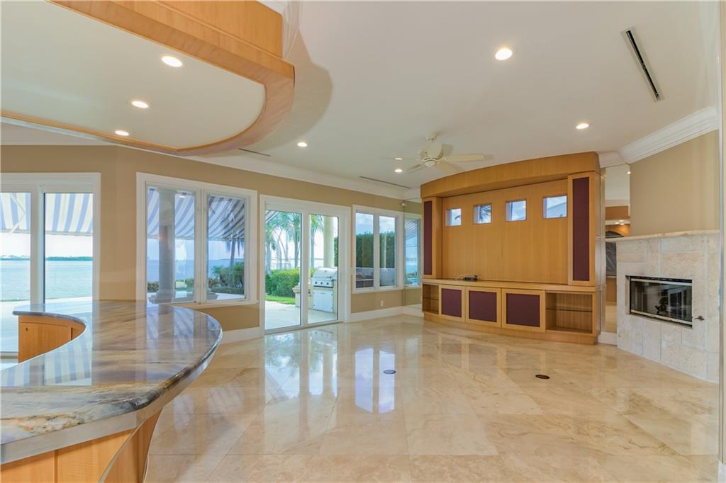 18 Island Road Stuart, FL 34996 - Photo 25 of 58 Casual Living Area that Leads Right to Outdoor Living space and Grille Station