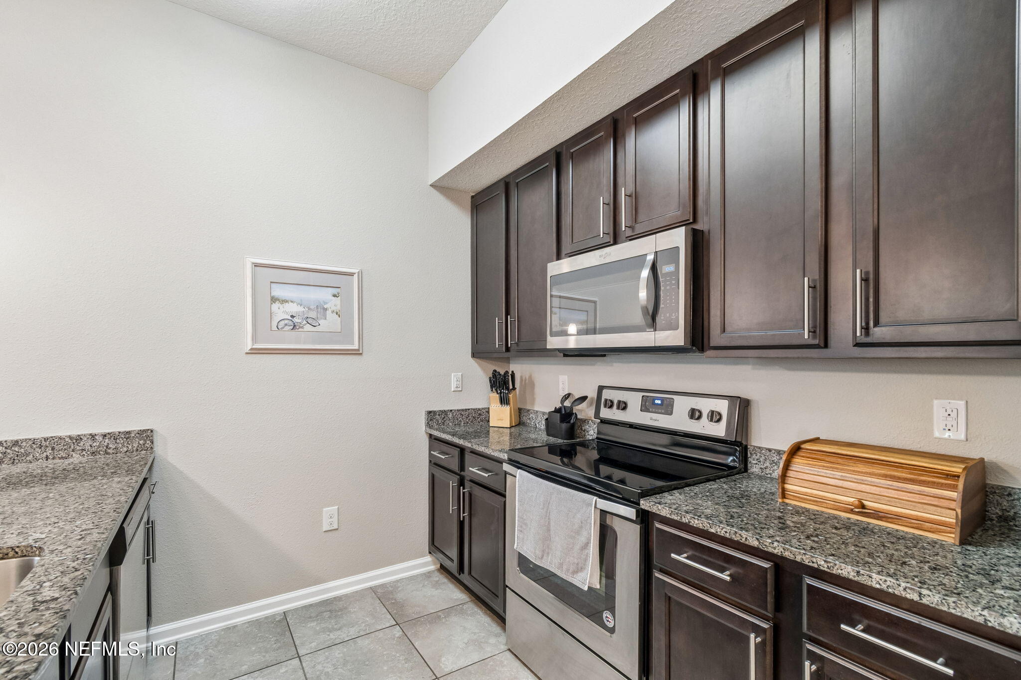 2113 Golden Lake Loop St. Augustine, FL 32084 - Photo 18 of 50 a kitchen with stainless steel appliances granite countertop a sink stove and cabinets