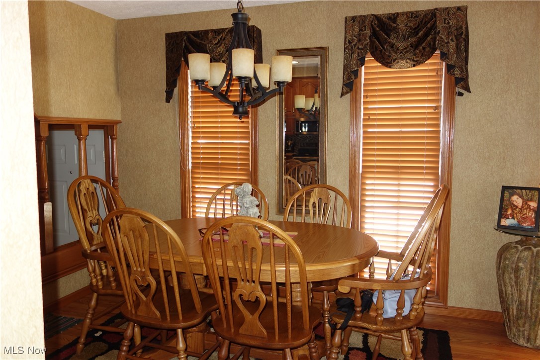 955 Center Road Clinton, OH 44216 - Photo 17 of 40 Rich Decor in the dining area + Table & chairs that stay
