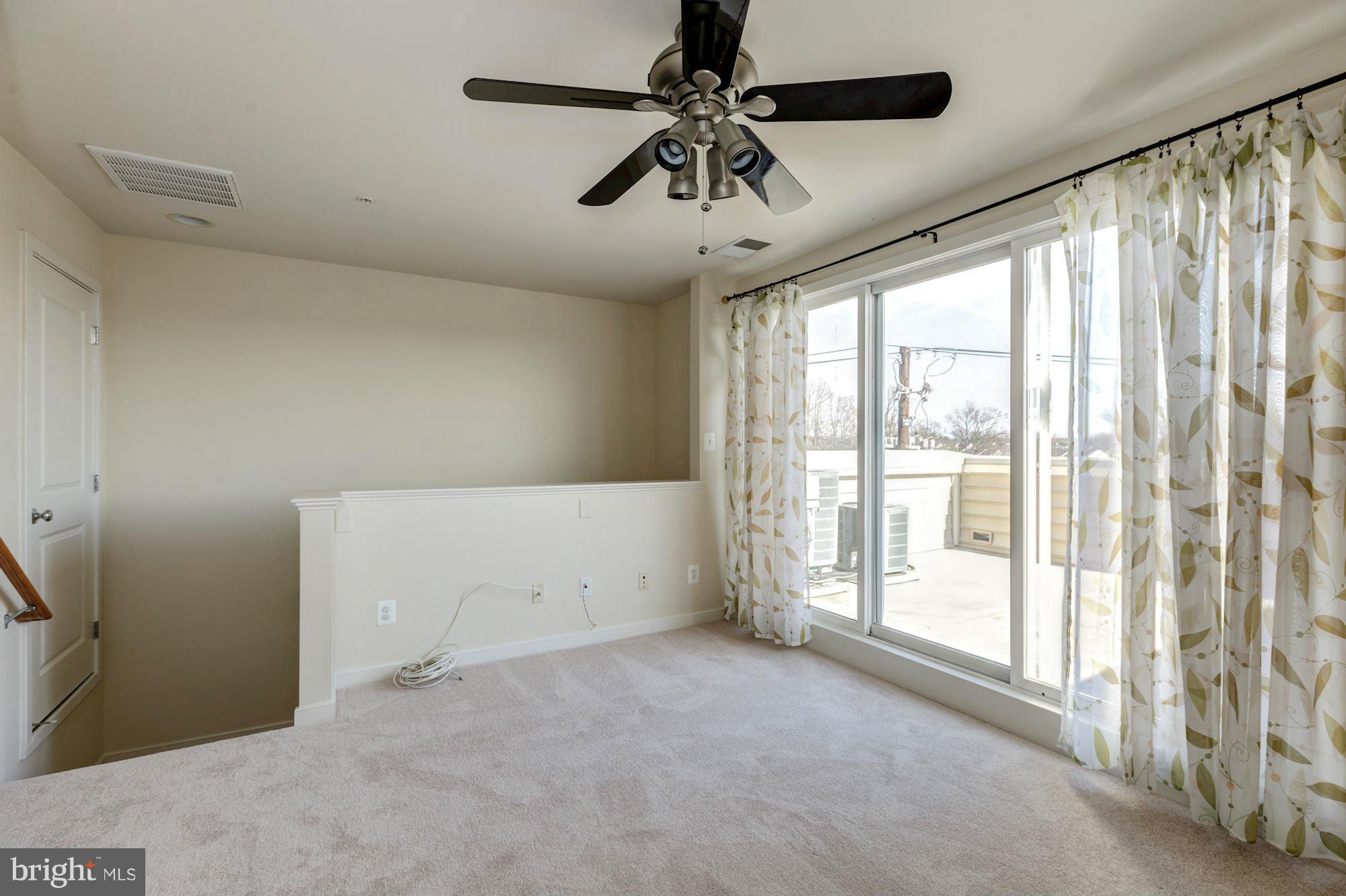 11110 Amherst Avenue Silver Spring, MD 20902 - Photo 22 of 28 Bedroom #3 with adjacent rooftop deck