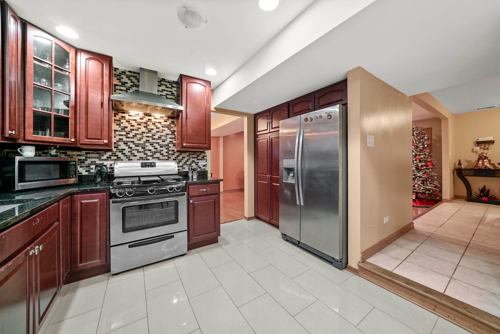 882 Pontiac Lane Carol Stream, IL 60188 - Photo 11 of 30 a kitchen with stainless steel appliances granite countertop a refrigerator and a sink