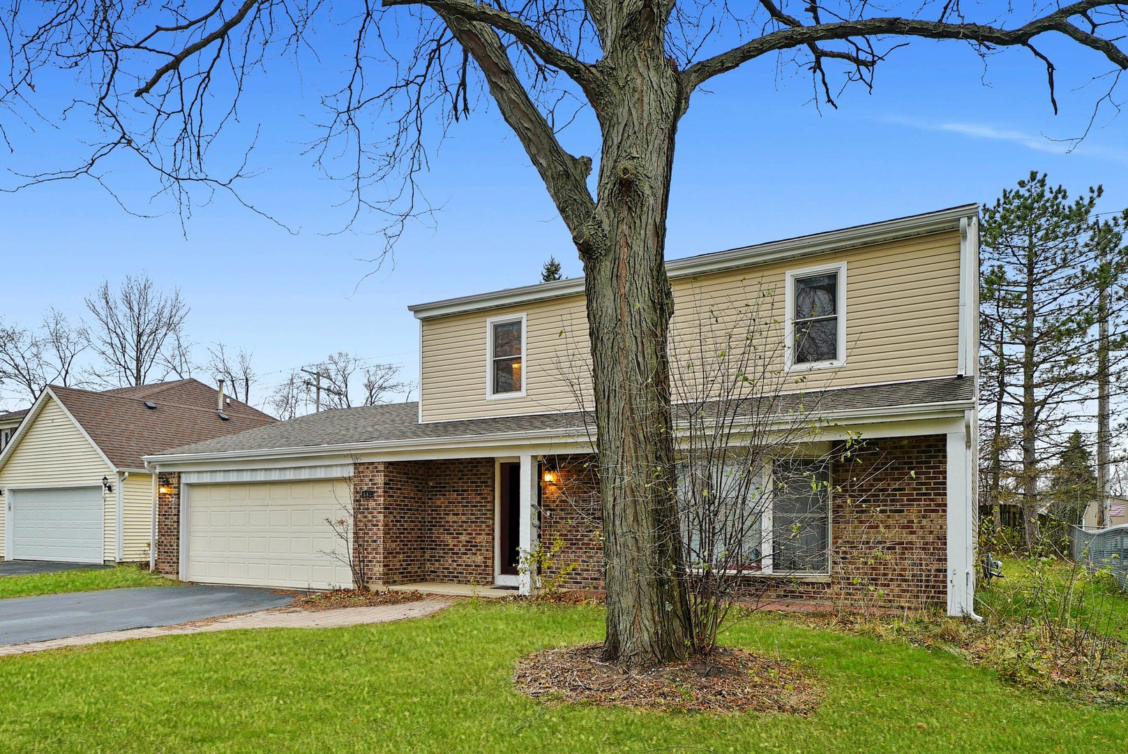882 Pontiac Lane Carol Stream, IL 60188 - Photo 3 of 30 a front view of a house with a yard and garage
