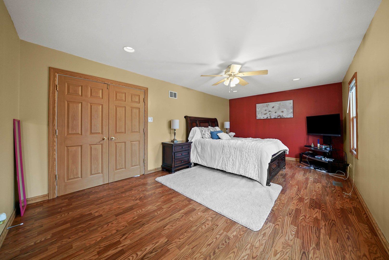 882 Pontiac Lane Carol Stream, IL 60188 - Photo 21 of 30 a spacious bedroom with a bed and a chandelier