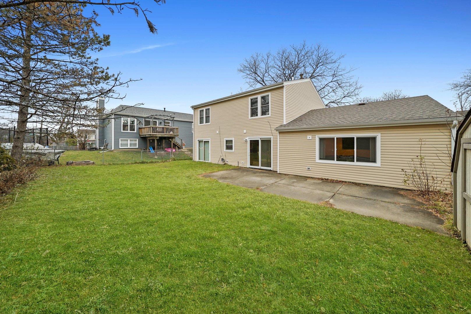 882 Pontiac Lane Carol Stream, IL 60188 - Photo 29 of 30 a view of a yard in front of a house with large tree