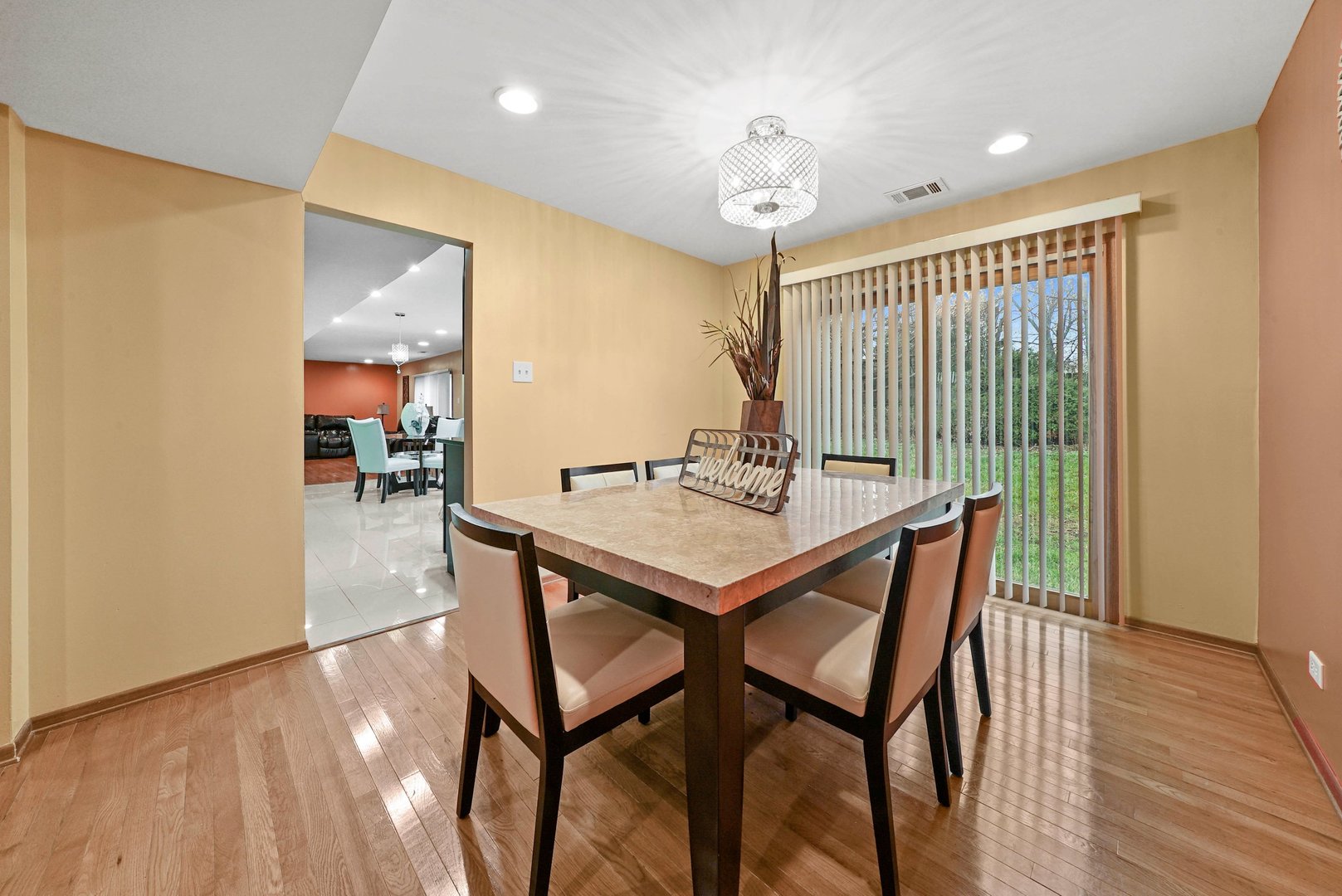882 Pontiac Lane Carol Stream, IL 60188 - Photo 10 of 30 a view of a dining room with furniture and wooden floor