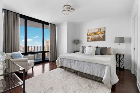 a bedroom with bed and window