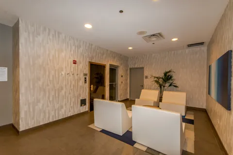 a room with a couch and a flat screen tv