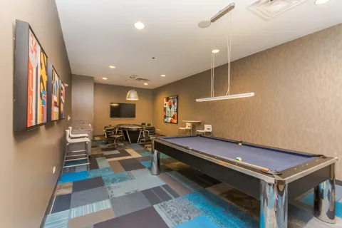 a lobby with furniture and rug