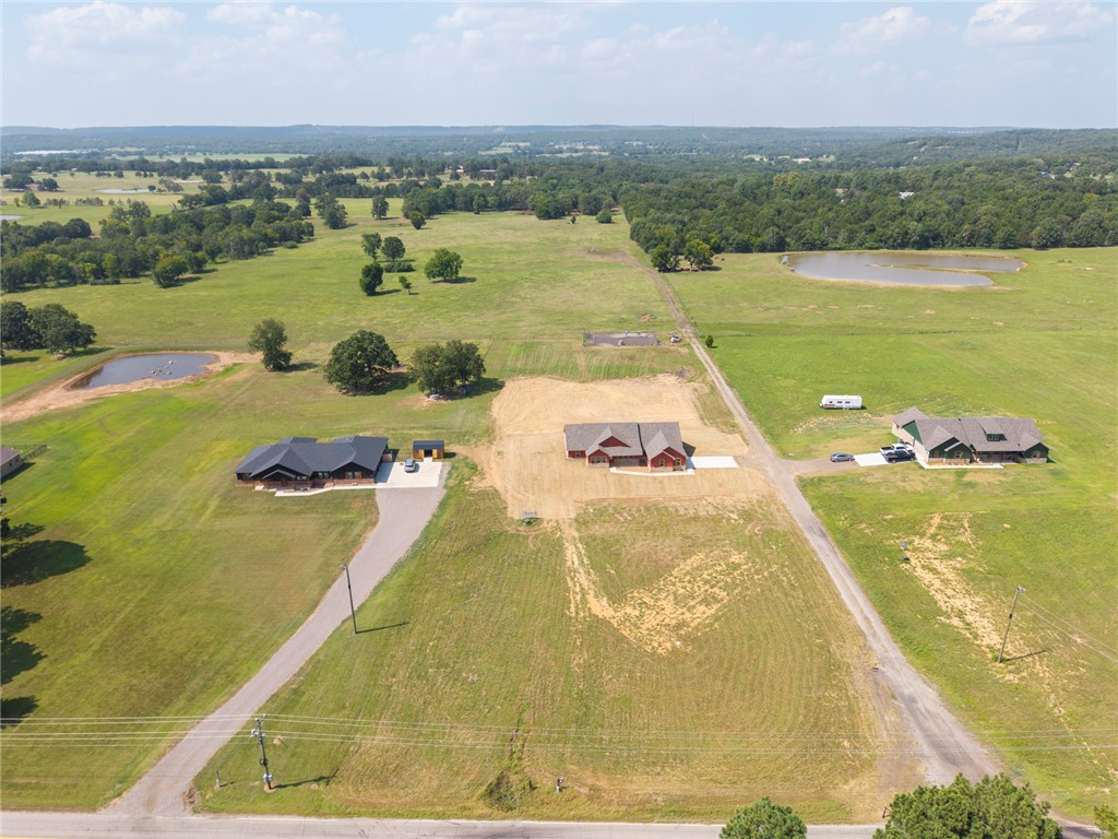 6138 New Hope Road Hackett, AR 72937 - Photo 16 of 56 Sprawling acreage featuring multiple homes, expansive cleared land, and established ponds
