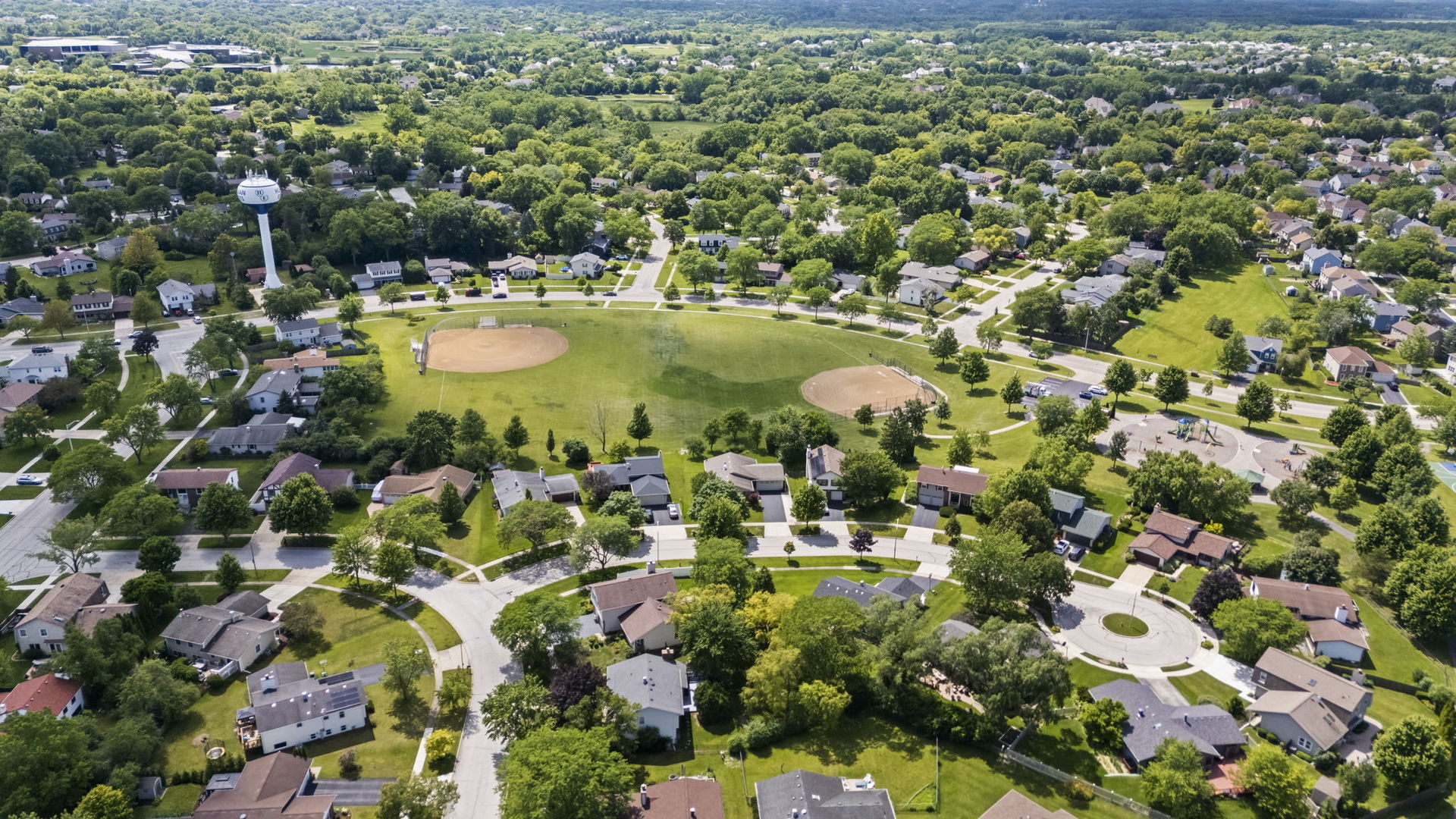 1565 Freeman Road Hoffman Estates, IL 60192 - Photo 43 of 46 a view of a lake with houses