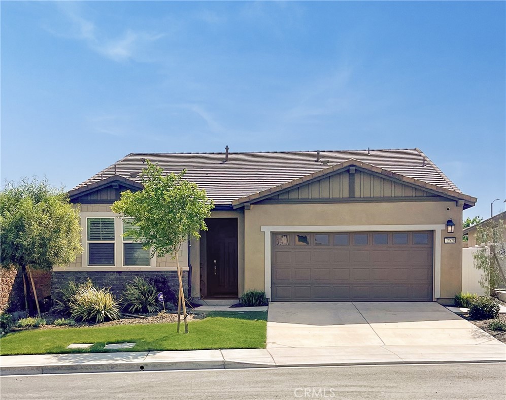 2528 Yellowstone Way Rialto, CA 92377 - Photo 1 of 1 a front view of a house with a garden