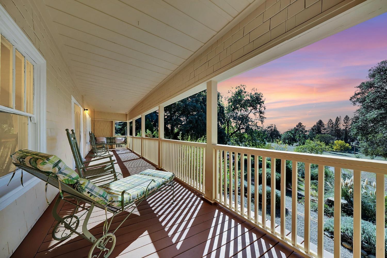 15579 Jesus Maria Road Mokelumne Hill, CA 95245 - Photo 2 of 91 a view of balcony with wooden floor and outdoor seating
