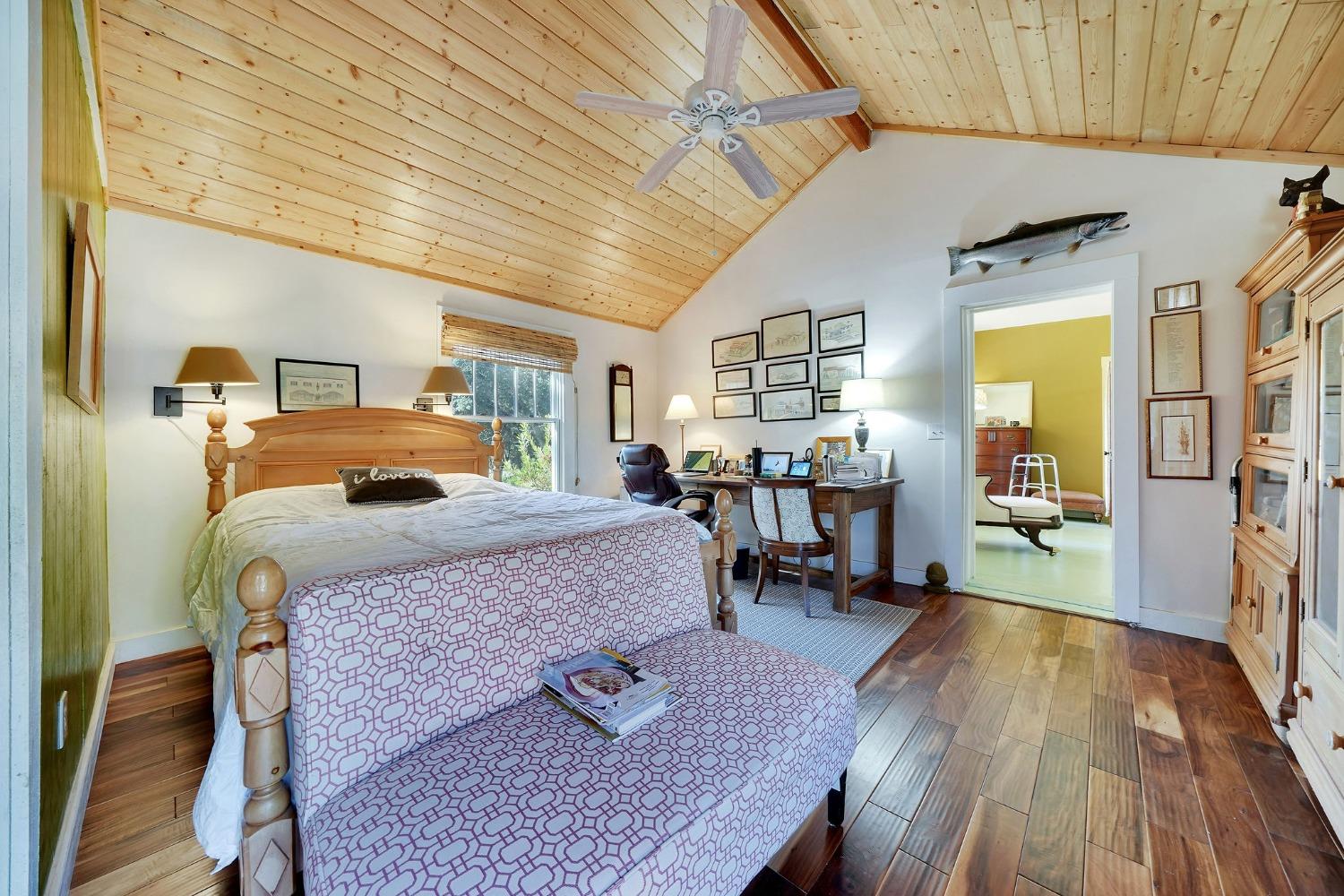 15579 Jesus Maria Road Mokelumne Hill, CA 95245 - Photo 27 of 91 a bedroom with a bed and wooden floor
