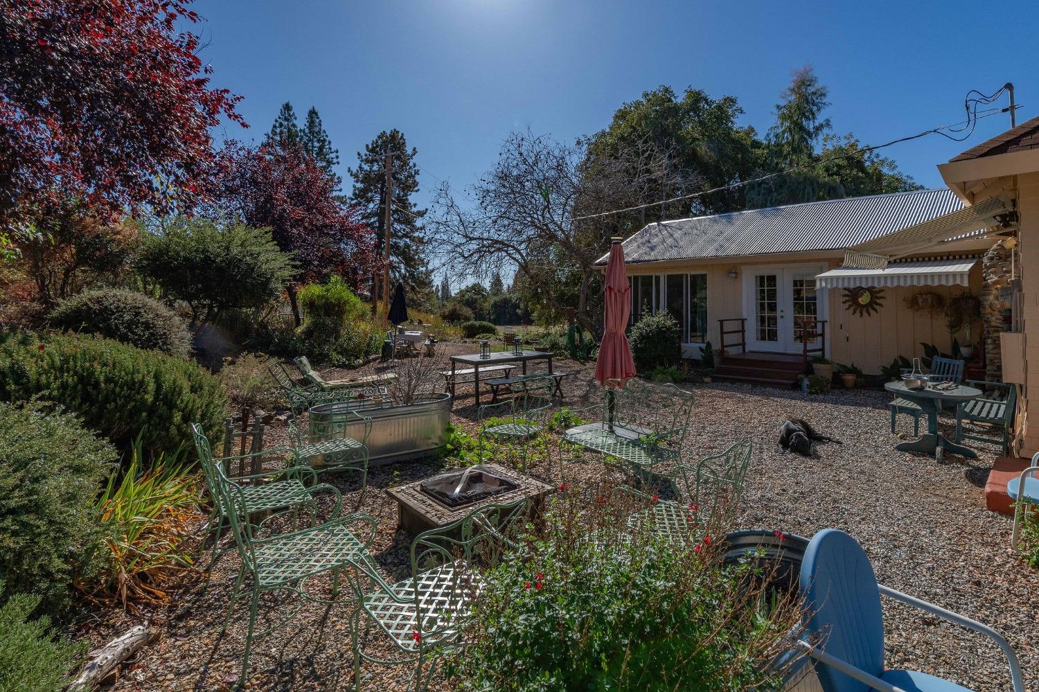 15579 Jesus Maria Road Mokelumne Hill, CA 95245 - Photo 46 of 91 a backyard of a house with yard fire pit and outdoor seating