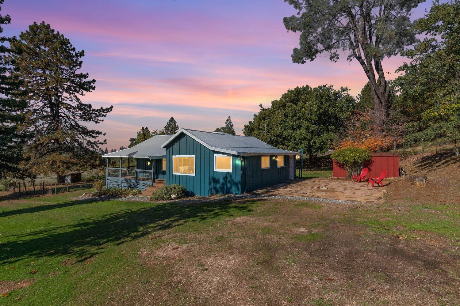 15579 Jesus Maria Road Mokelumne Hill, CA 95245 - Photo 53 of 91 a front view of a house with a yard and garage