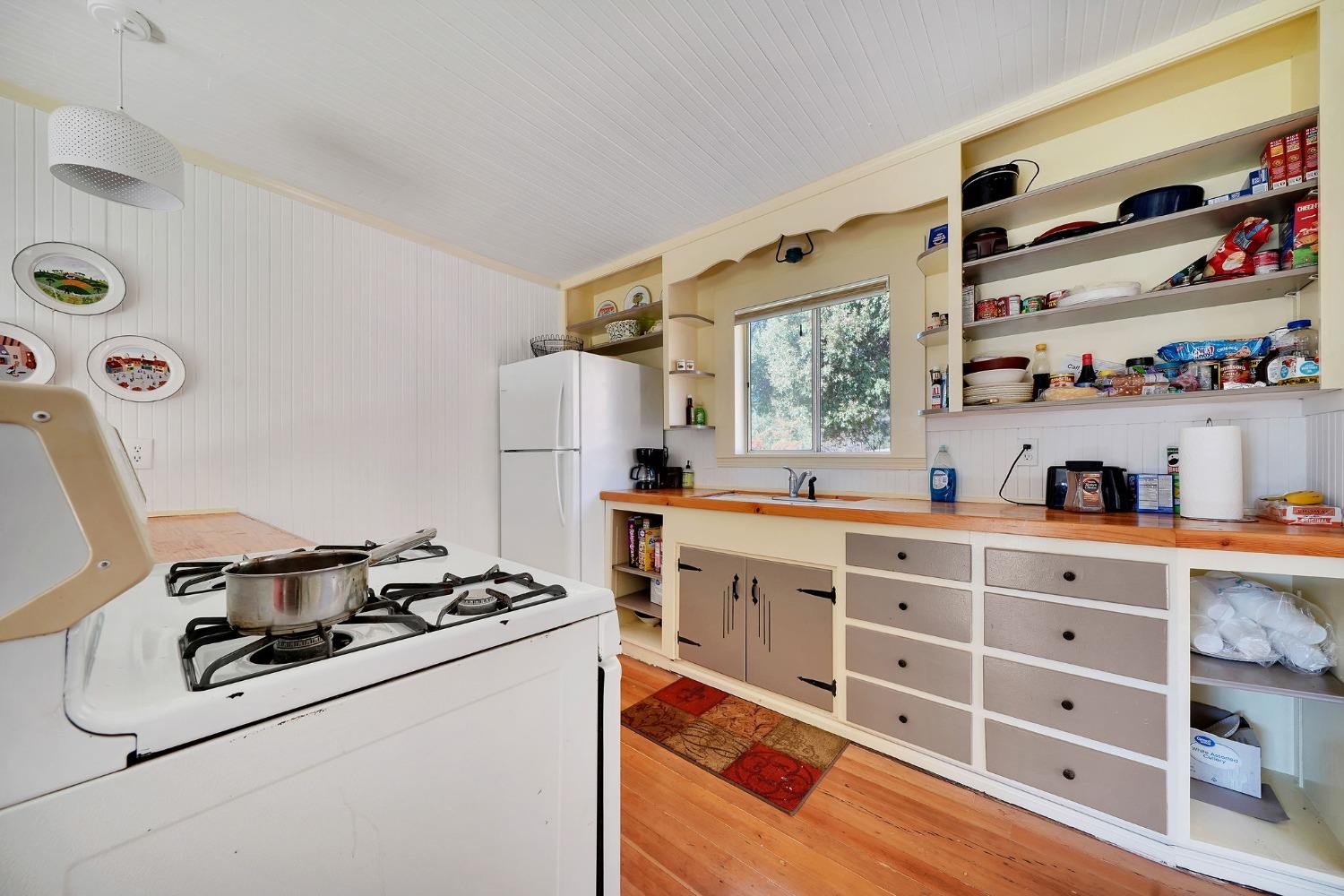 15579 Jesus Maria Road Mokelumne Hill, CA 95245 - Photo 57 of 91 a kitchen with stainless steel appliances a stove a sink and a refrigerator