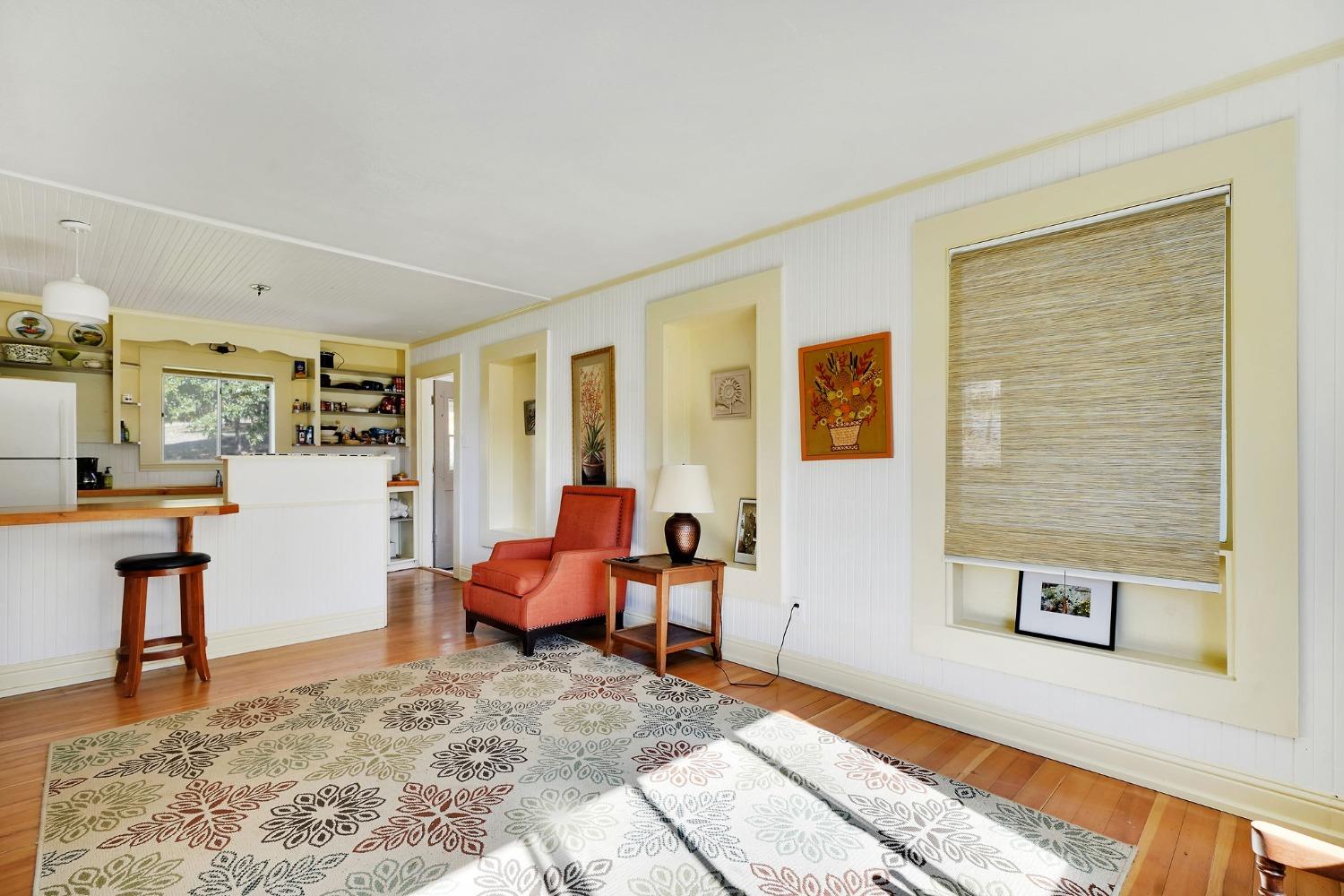 15579 Jesus Maria Road Mokelumne Hill, CA 95245 - Photo 62 of 91 a living room with furniture and paintings on the wall