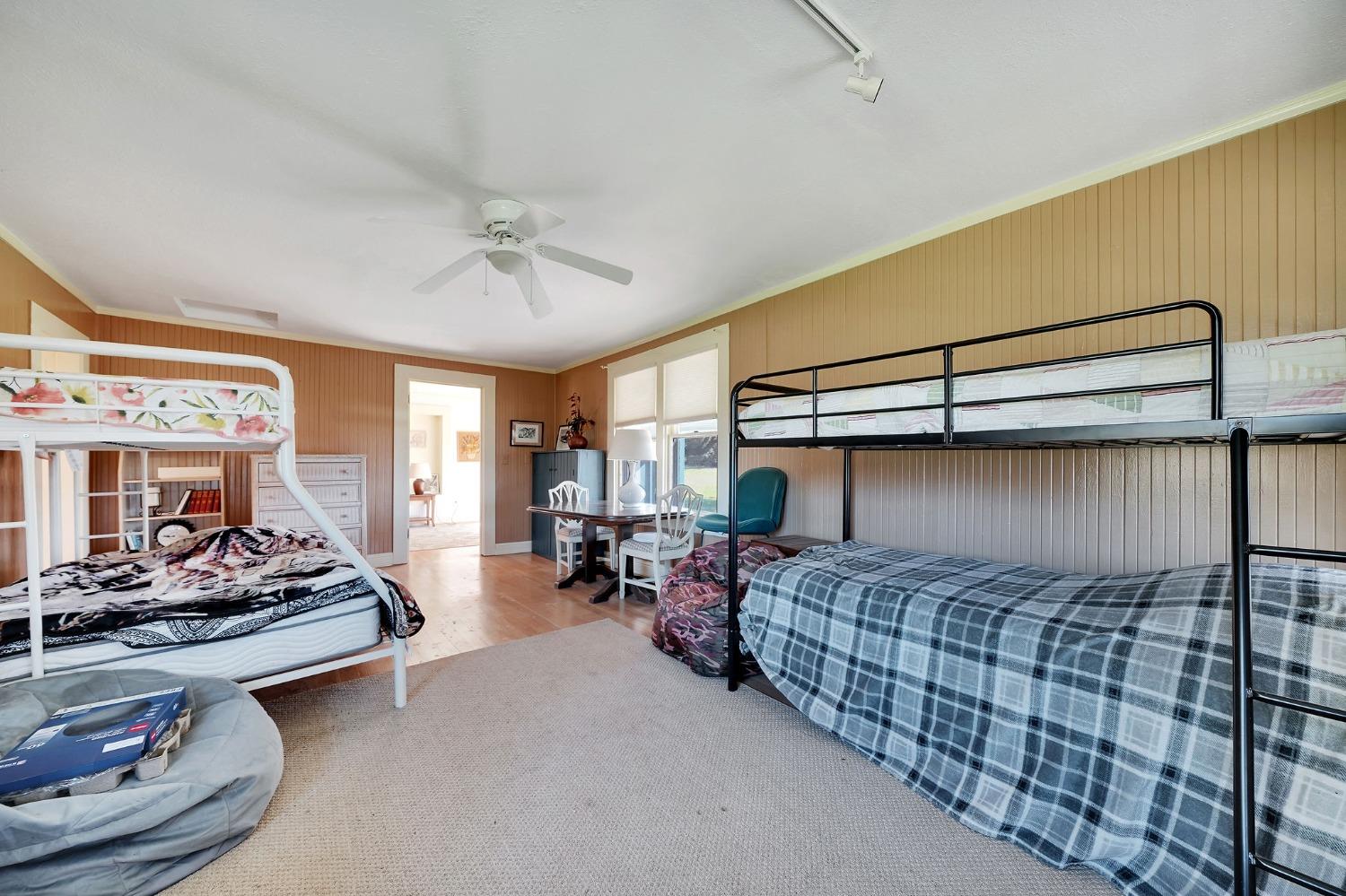 15579 Jesus Maria Road Mokelumne Hill, CA 95245 - Photo 66 of 91 a bedroom with bed couch and window