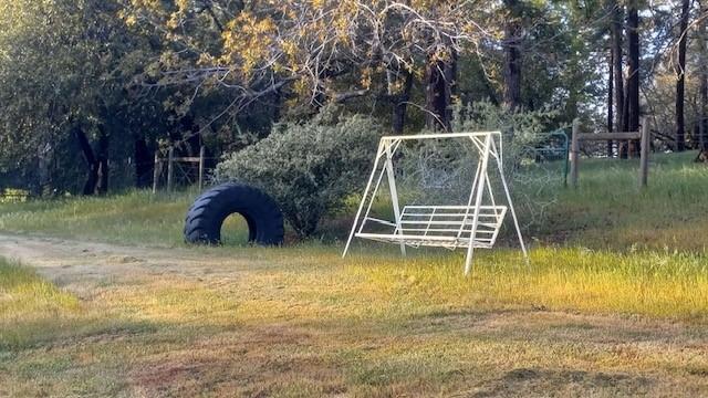 15579 Jesus Maria Road Mokelumne Hill, CA 95245 - Photo 85 of 91 a backyard of a house with table and chairs