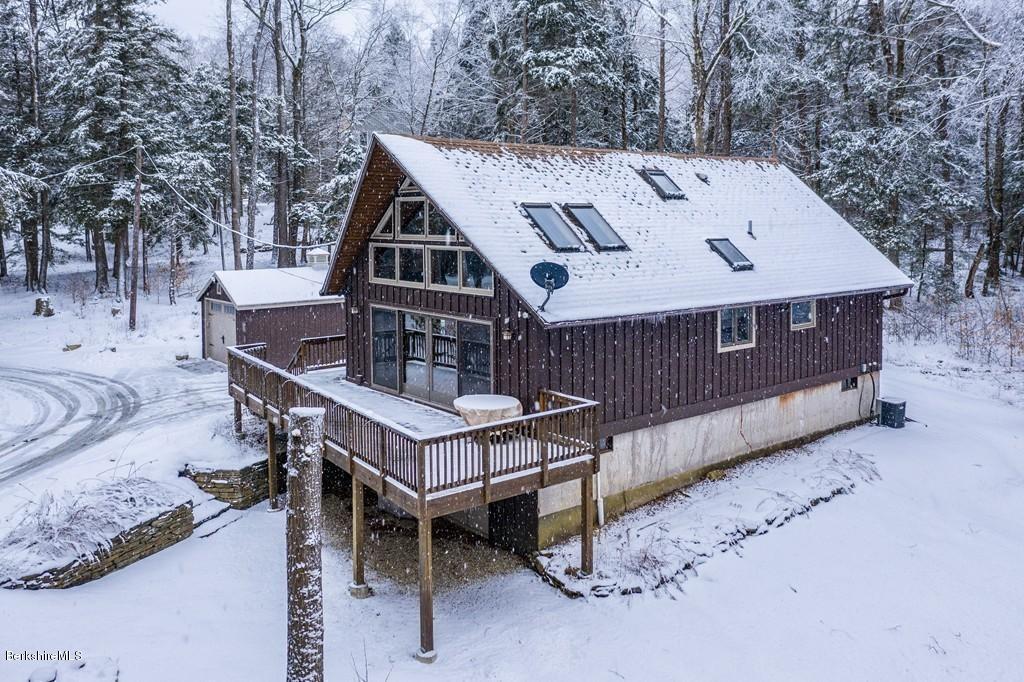 237 Slope Road Tolland, MA 01034 - Photo 4 of 40 a roof view covered with tall trees