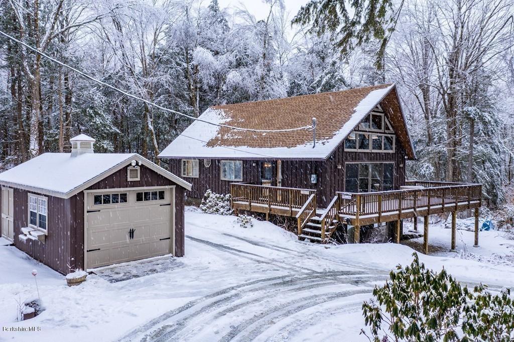 237 Slope Road Tolland, MA 01034 - Photo 40 of 40 a front view of a house with yard and sitting area