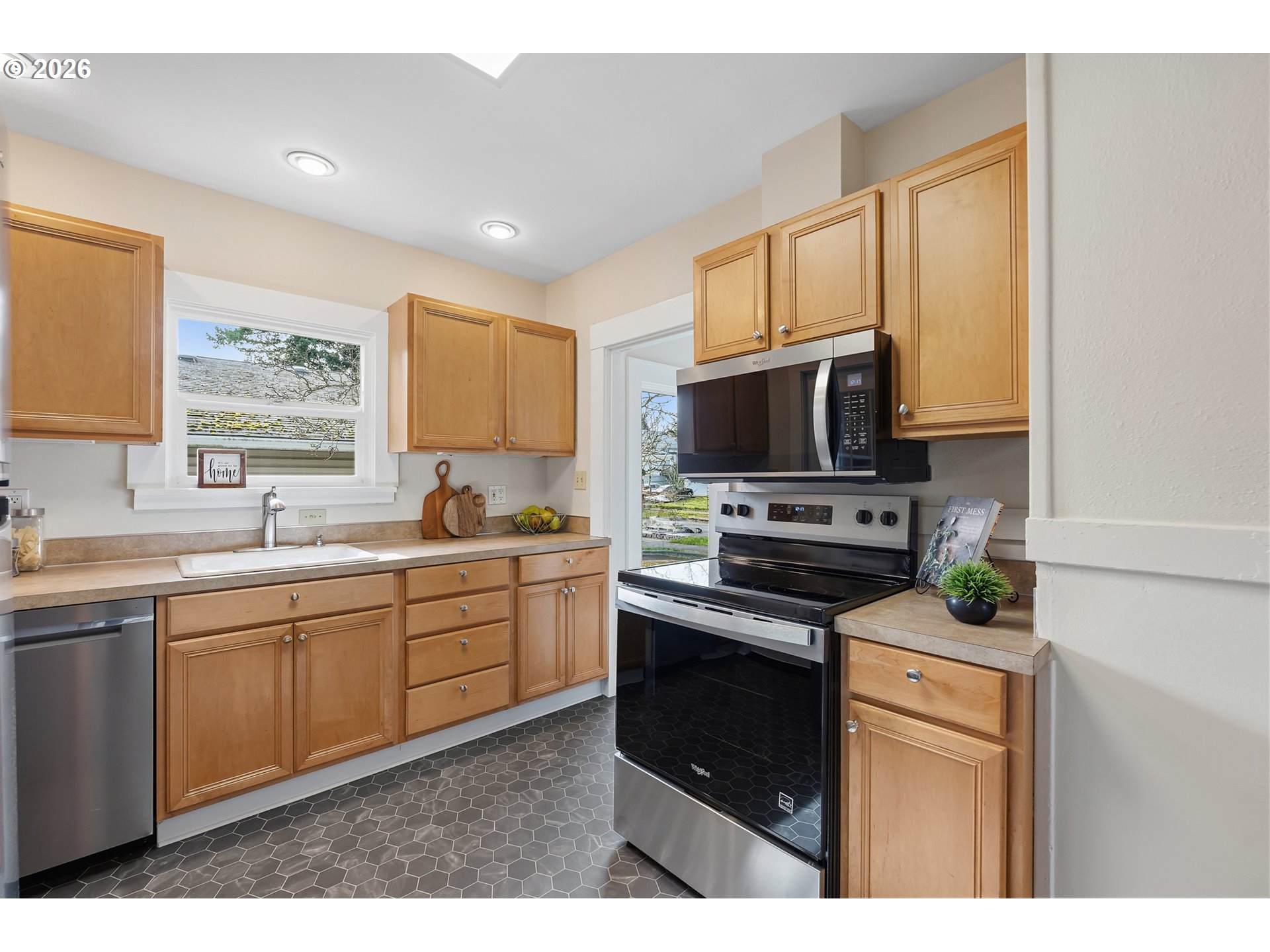 3134 Northeast 74th Avenue Portland, OR 97213 - Photo 14 of 42 a kitchen with a sink stove and microwave
