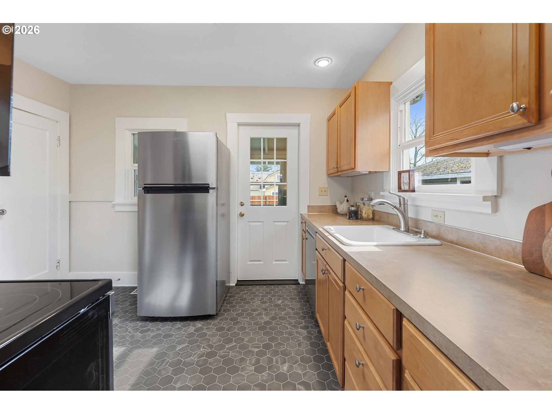 3134 Northeast 74th Avenue Portland, OR 97213 - Photo 16 of 42 a kitchen with a refrigerator and a sink