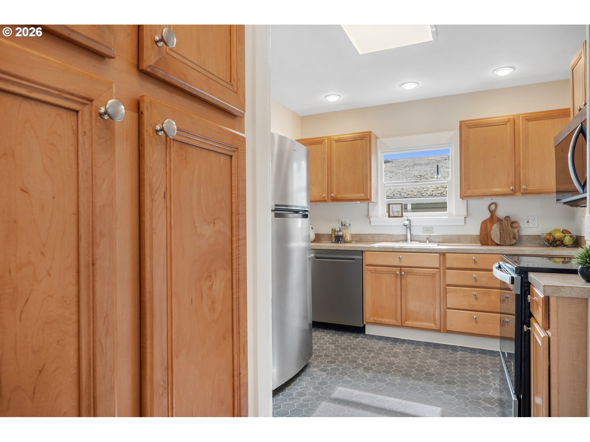 3134 Northeast 74th Avenue Portland, OR 97213 - Photo 18 of 42 a kitchen with a refrigerator and a sink
