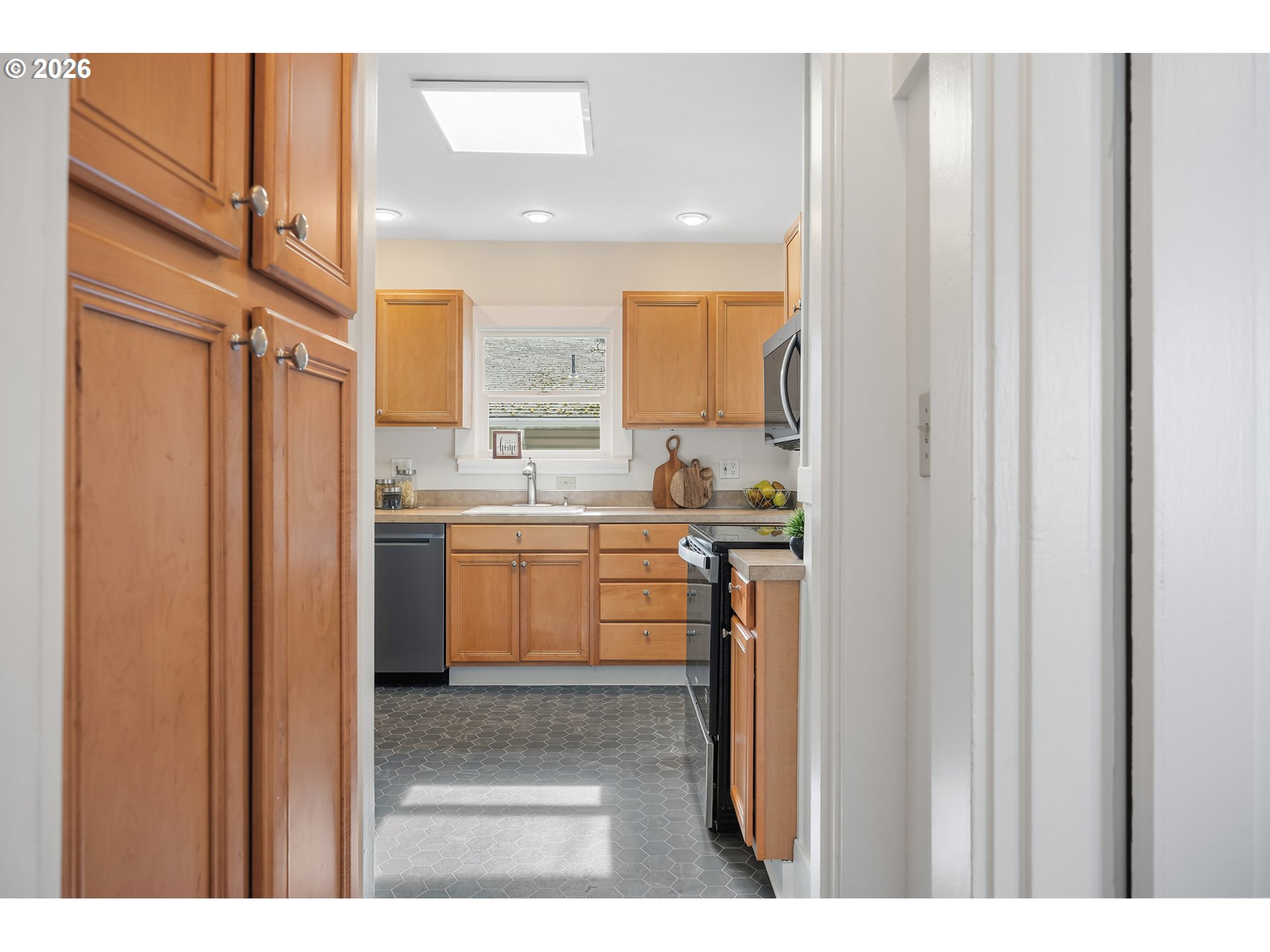 3134 Northeast 74th Avenue Portland, OR 97213 - Photo 19 of 42 a kitchen with a refrigerator and a sink