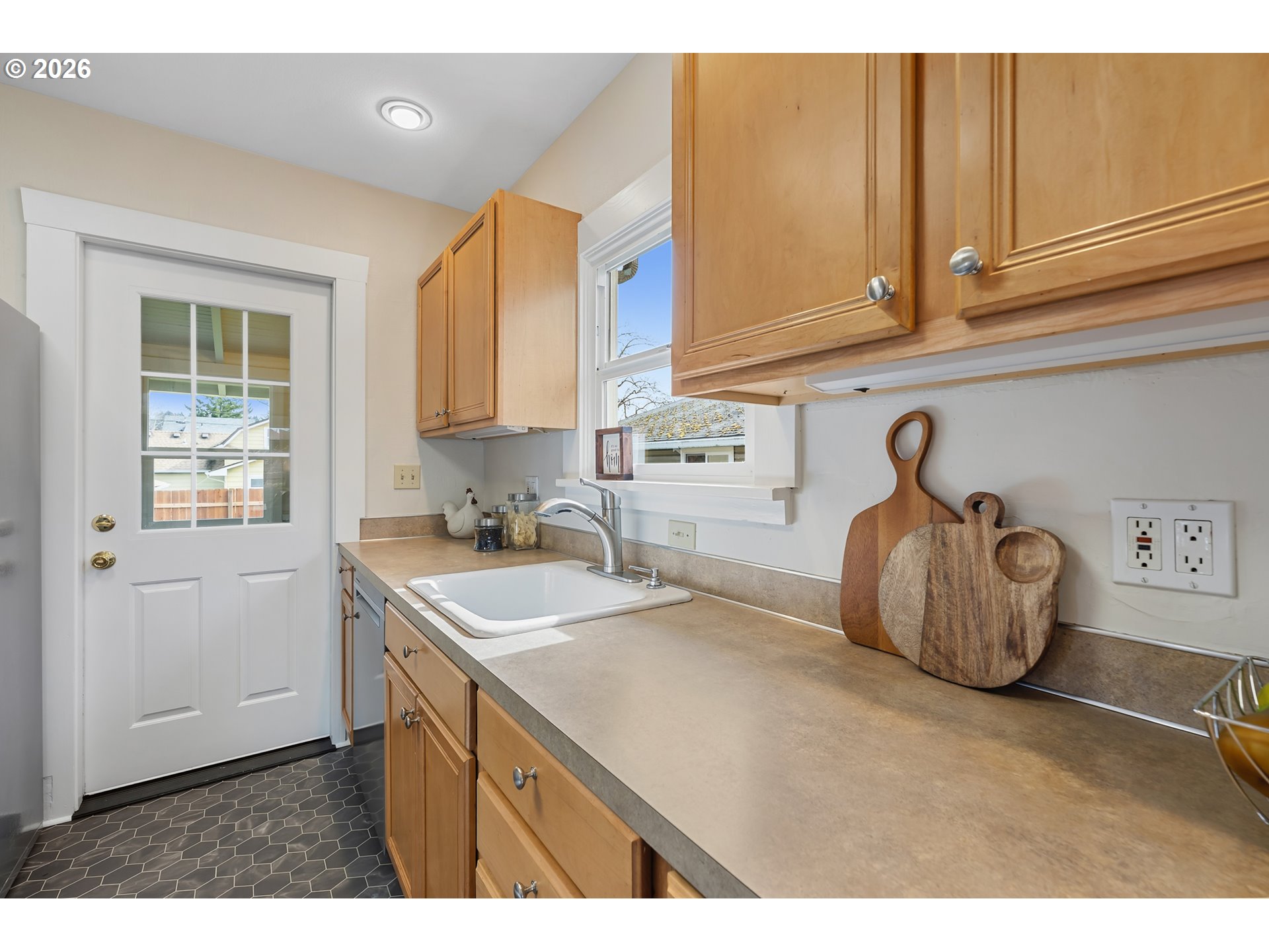 3134 Northeast 74th Avenue Portland, OR 97213 - Photo 21 of 42 a kitchen with a sink cabinets and a window