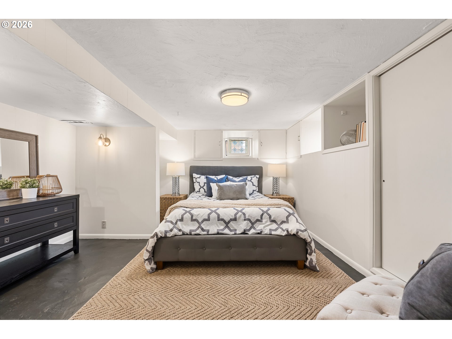 3134 Northeast 74th Avenue Portland, OR 97213 - Photo 29 of 42 a bedroom with a bed and a night stand