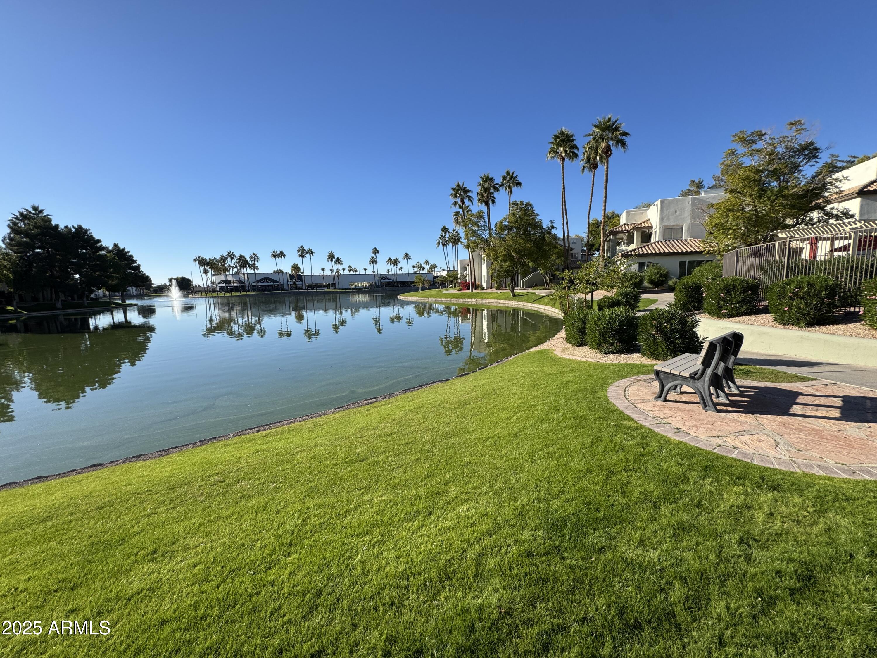 a view of a lake with a house in the background