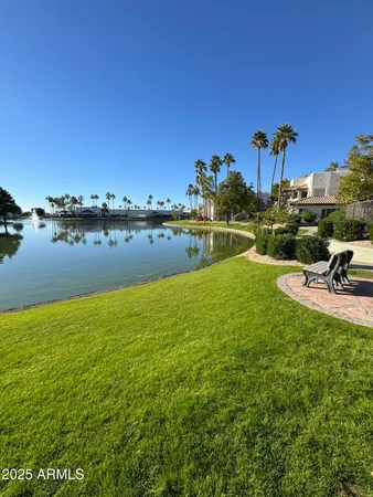 a view of a swimming pool with outdoor seating