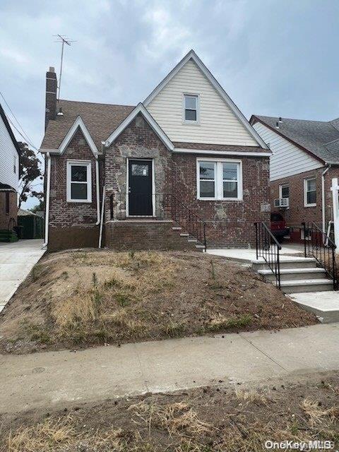 139-40 230th Place Queens, NY 11413 - Photo 1 of 1 a front view of a house with a yard