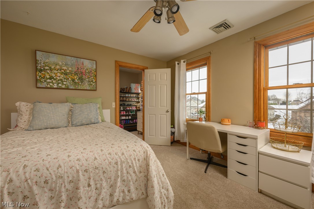 806 Forrest Ridge Drive Dover, OH 44622 - Photo 26 of 36 Bedroom featuring a desk, light colored carpet, and ceiling fan