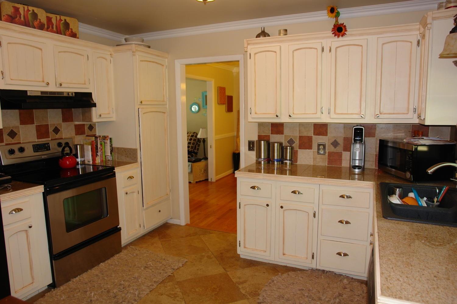 2969 Tree Swallow Road Roanoke, VA 24018 - Photo 9 of 31 a kitchen with stainless steel appliances granite countertop a refrigerator and a stove
